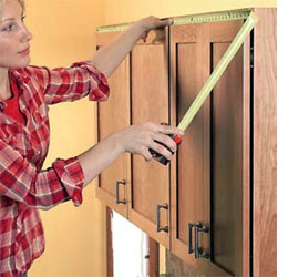 Make a shelf for top of cabinets
