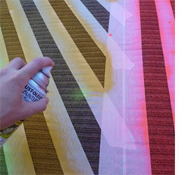 Use spray paint on rugs and carpet