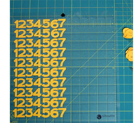 Colourful clock with embossed detail 