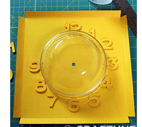 Colourful clock with embossed detail 