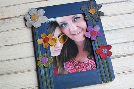 photo frame that is decorated with fabric scraps from old clothes