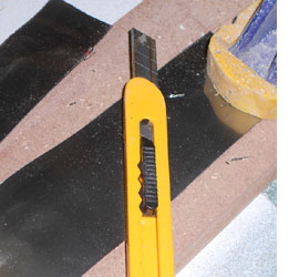 cut tin can with craft knife