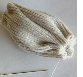 Here's how to upcycle a sweater or jersey into cushion cover
