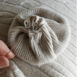 Here's how to upcycle a sweater or jersey into cushion cover