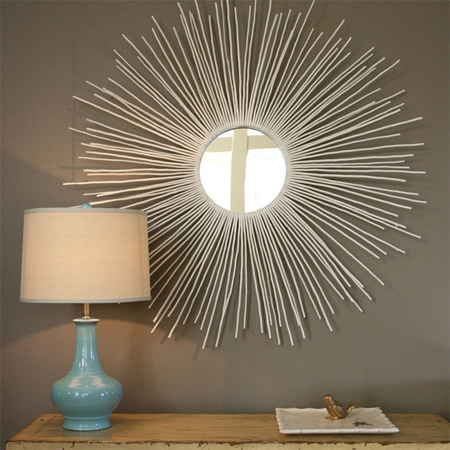 Sunburst mirror with twigs