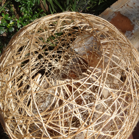 Extra large string lampshade using pilates ball or large balloon hole cut at top for mounting