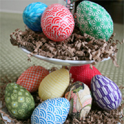 Decorate eggs with paper or fabric