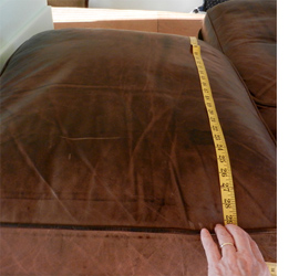 Fix flat cushions on a leather sofa