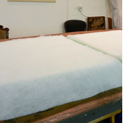 Fix flat cushions on a leather sofa 
