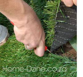 cutting artificial turf