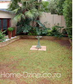 patchy brown lawn before artificial turf