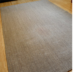 Use acrylic paint to stencil design on a rug or mat