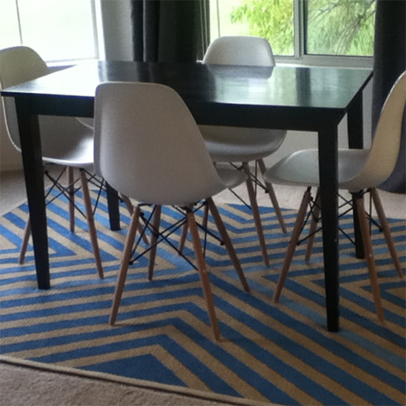 Use acrylic paint to stencil design on a rug or mat