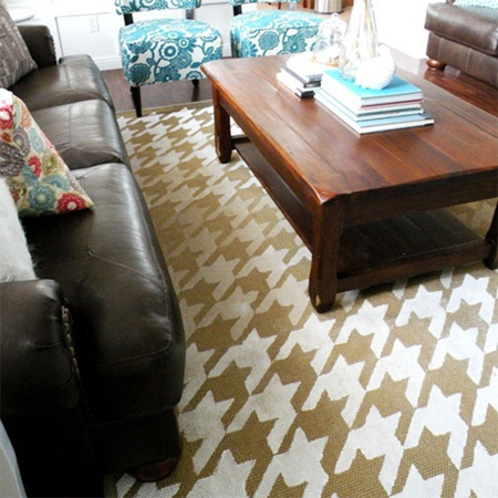 Use acrylic paint to stencil design on a rug or mat