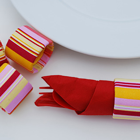 Make serviette rings from cardboard tubes 