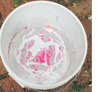 Paint pots splashed with nail varnish 