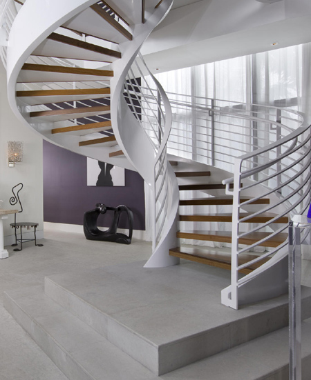modern contemporary curved staircase with steel sides and timber wood stair treads