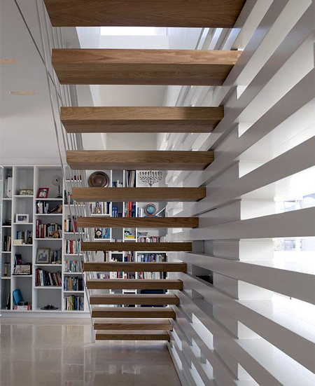 contemporary modern staircase with steel and wire sides