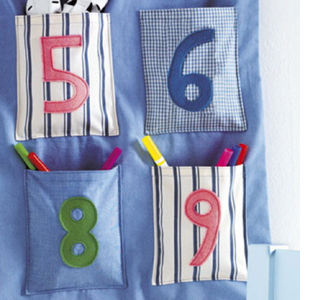 Fabric pocket organiser for child's bedroom 