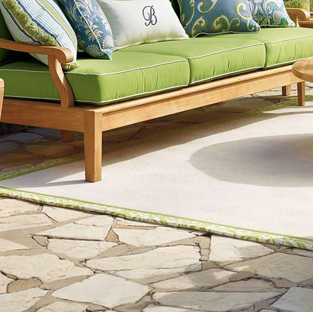 Trim plain rugs with fabric trim 