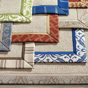 Trim plain rugs with a fabric border 