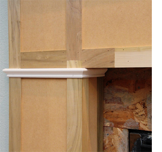 Build a fireplace surround with mantel shelf