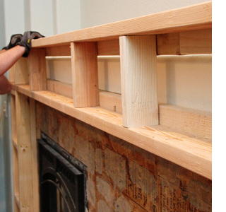 Build a fireplace surround with mantel shelf