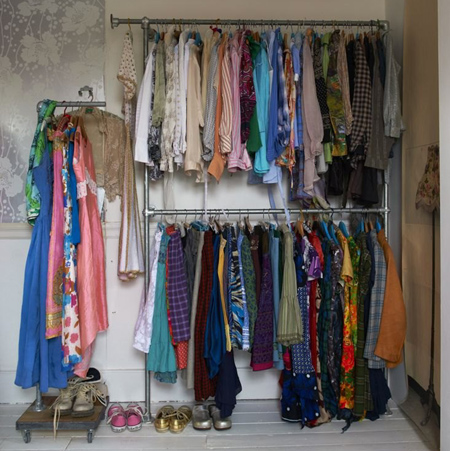 Eclectic style in vintage home gavanized pipe closet clothes hanger rack