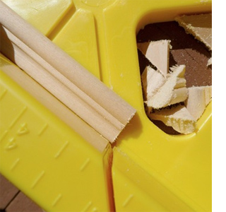 add pine moulding to furniture chest of drawers cut moulding with mitre box