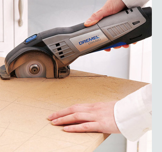 Use a Dremel DSM20 Cutting Tool or jigsaw