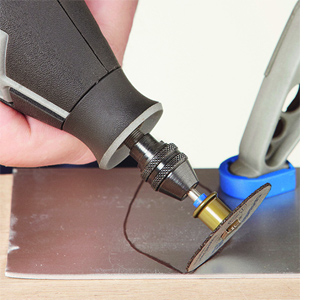 vintage secondhand cutlery chandelier dremel tools