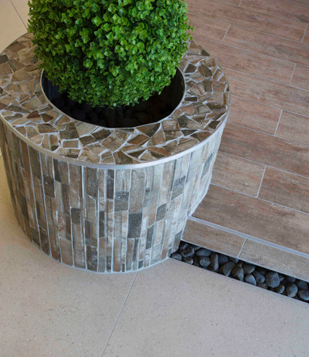 Tile indoors and outdoors for a seamless flow 