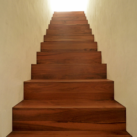 clad concrete staircase with wood risers and steps completed
