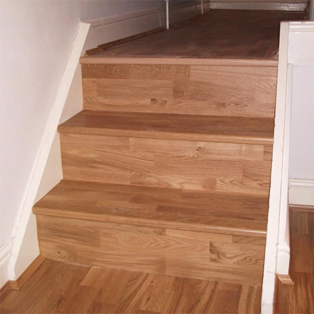 Clad A Staircase With Wood, How To Put Laminate Flooring On Concrete Stairs