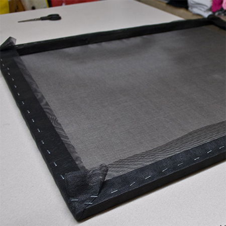 cover the pine frame for the fireplace screen with mesh fabric