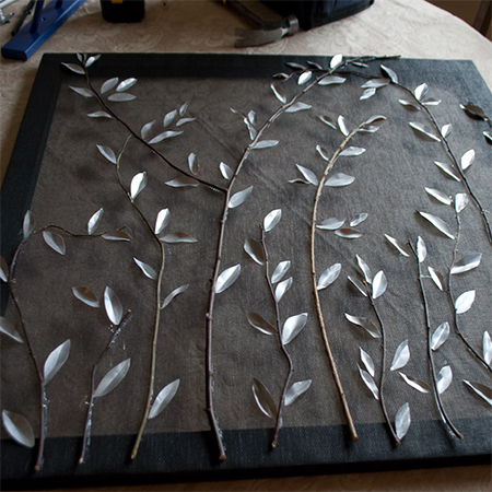 cut of aluminium cans for leaves for the fireplace screen