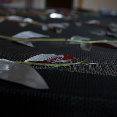 use tins snips or dremel multitool to cut leaf shapes from recycled aluminium cans