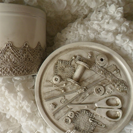 sewing kit made from old biscuit tin