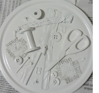 Turn an old tin into a gorgeous decor accessory