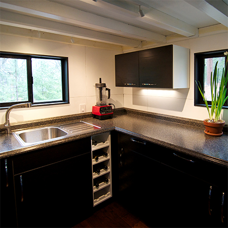 living off the grid in a small home that is battery and gas powered