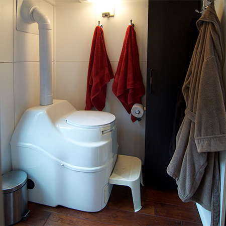 living off the grid in a small home that is battery and gas powered