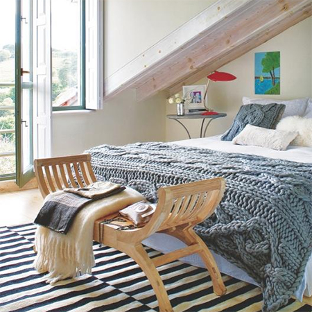 how to decorate warm comfortable cosy bedroom knitted throw