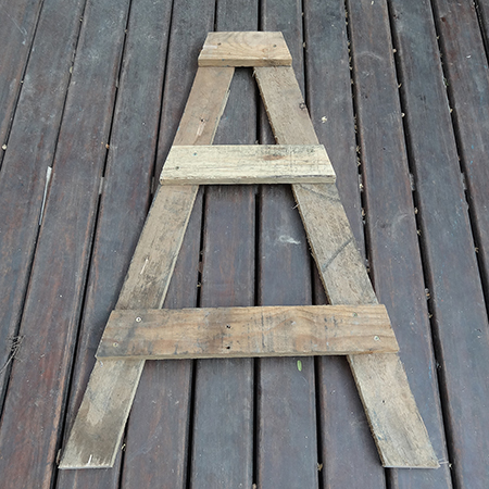 Herb or plant stand using reclaimed wood pallet