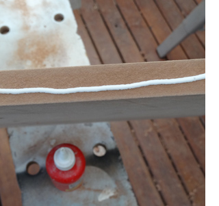 DIY laptop stand or laptop lap tray apply wood glue to cut edges to seal