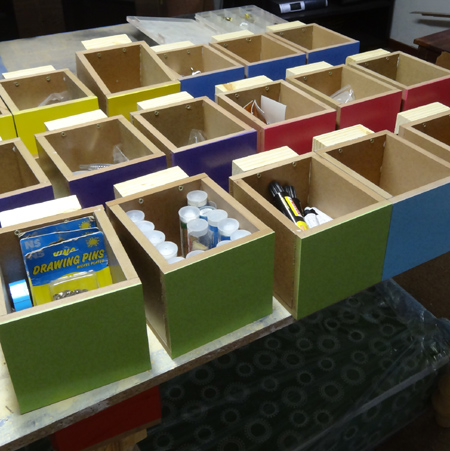 storage cabinets to house all our tools and supplies with colourful storage bins