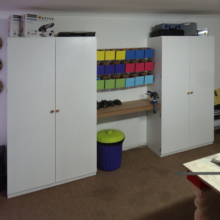 storage cabinets to house all our tools and supplies with colourful storage bins mounted with french cleat
