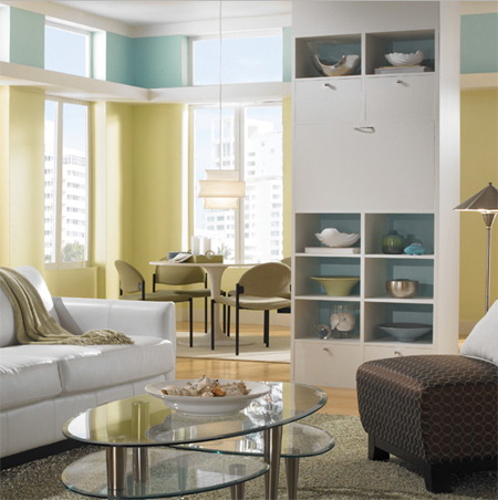 Moving towards aqua and combined with yellow, the colours in this open plan living and dining area are modern and fresh. The yellow freshens up the space while the blue at the top of the wall visually raises the height of the room.