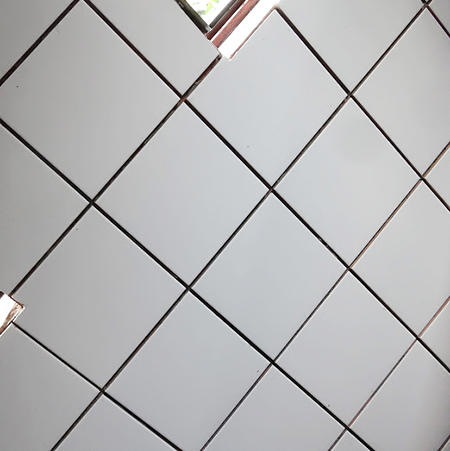 diy tiling kitchen placing white tiles on wall