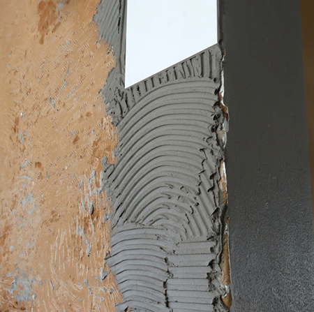 diy tiling kitchen placing white tiles on wall spread tile adhesive