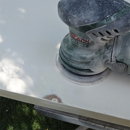 remove plain hollow core door from hinges and take outside to sand and paint